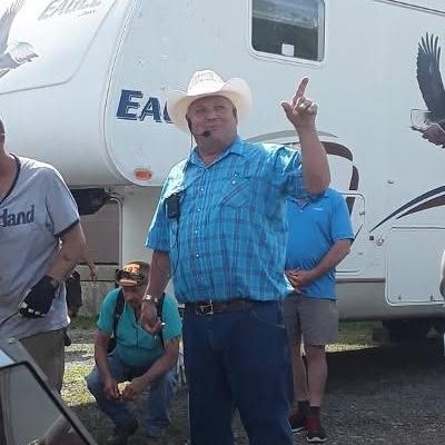 H. James Hill, owner and auctioneer, at an on-site auction